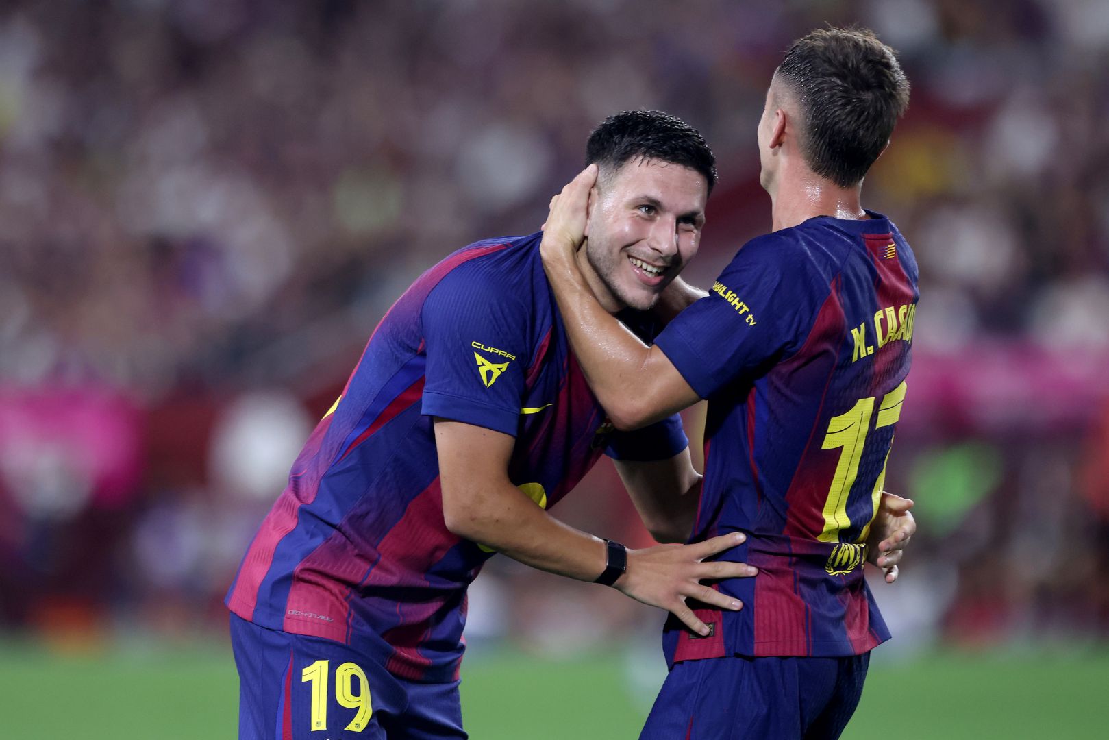 KOBE, JAPAN - JULY 27: FC Barcelona's Roony Bardghji (L) is congratulated by Marc Casado after scoring a goal during the preseason friendly between Vissel Kobe and FC Barcelona at Noevir Stadium Kobe on July 27, 2025 in Kobe, Hyogo, Japan.