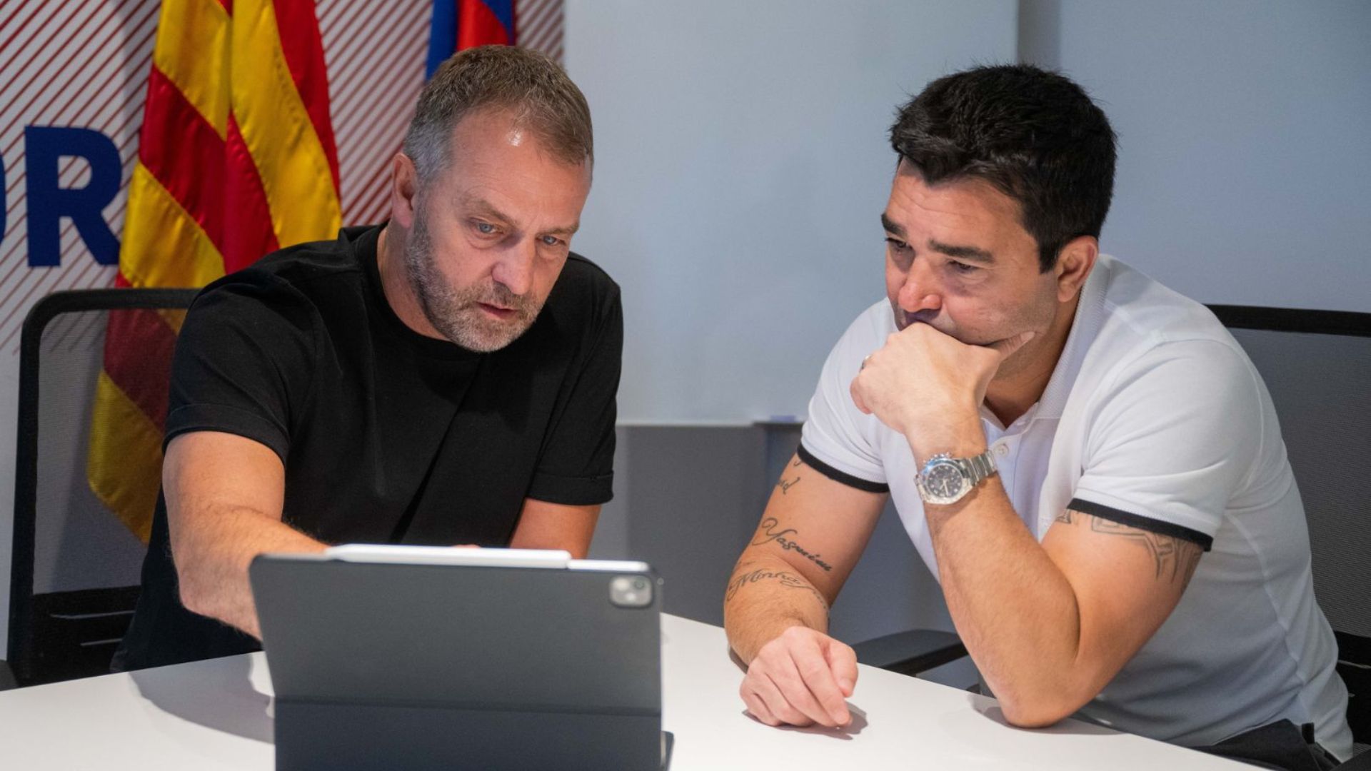 FC Barcelona head coach Hansi Flick with club director Deco planning for the upcoming season.