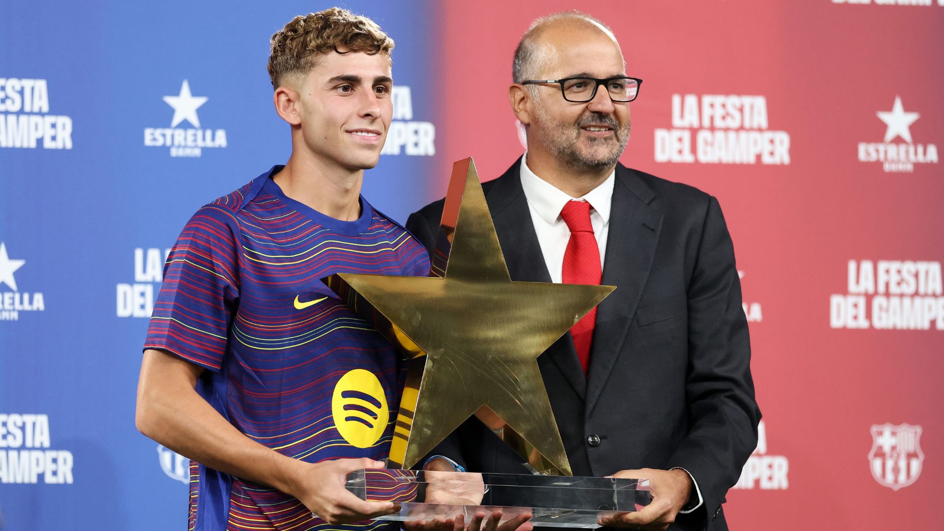 BARCELONA, SPAIN - AUGUST 10: Fermin Lopez of FC Barcelona is presented with the MVP trophy during the Joan Gamper Trophy match between FC Barcelona and Como1907 at Estadi Johan Cruyff on August 10, 2025 in Barcelona, Spain.
