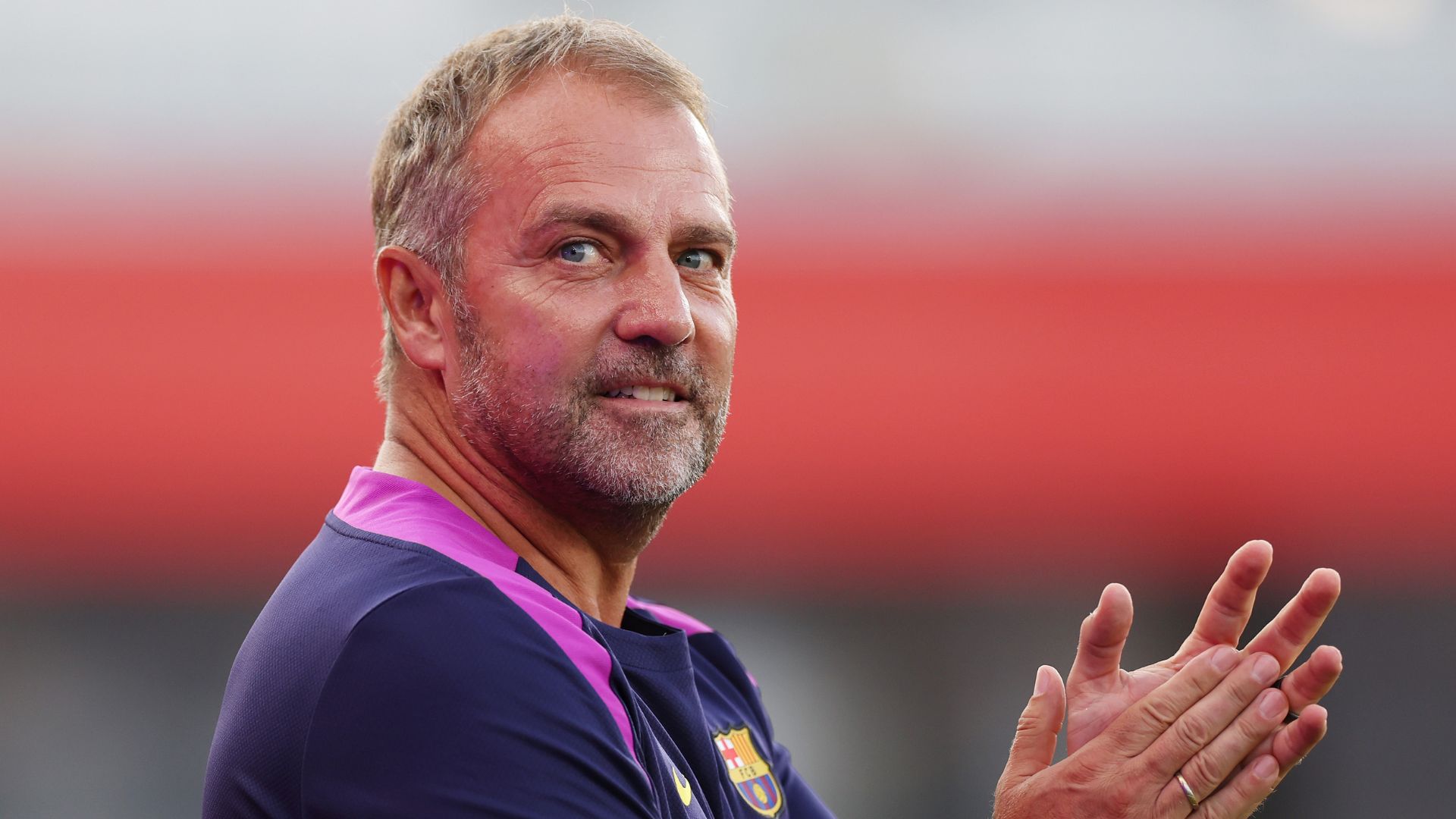 BARCELONA, SPAIN - AUGUST 10: Hansi Flick, Head Coach of FC Barcelona, is presented to the fans prior to the Joan Gamper Trophy match between FC Barcelona and Como1907 at Estadi Johan Cruyff on August 10, 2025 in Barcelona, Spain.