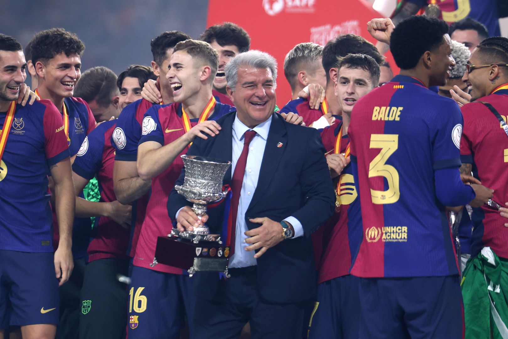 JEDDAH, SAUDI ARABIA - JANUARY 12: Joan Laporta, President of FC Barcelona, celebrates with the Supercopa de Espana winners' trophy during the trophy presentation after the Spanish Super Cup Final between Real Madrid and FC Barcelona at King Abdullah Sports City on January 12, 2025 in Jeddah, Saudi Arabia.