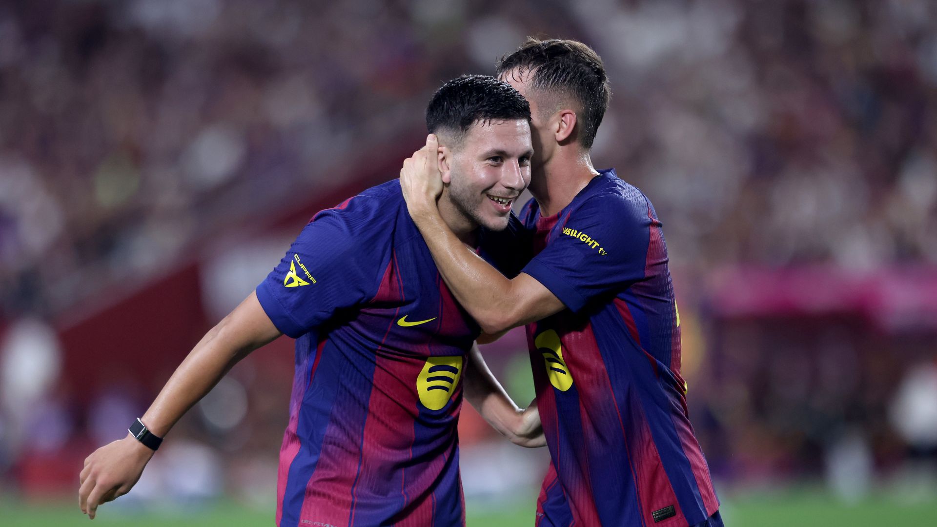 KOBE, JAPAN - JULY 27: FC Barcelona's Roony Bardghji (L) is congratulated by Marc Casado after scoring a goal during the preseason friendly between Vissel Kobe and FC Barcelona at Noevir Stadium Kobe on July 27, 2025 in Kobe, Hyogo, Japan.
