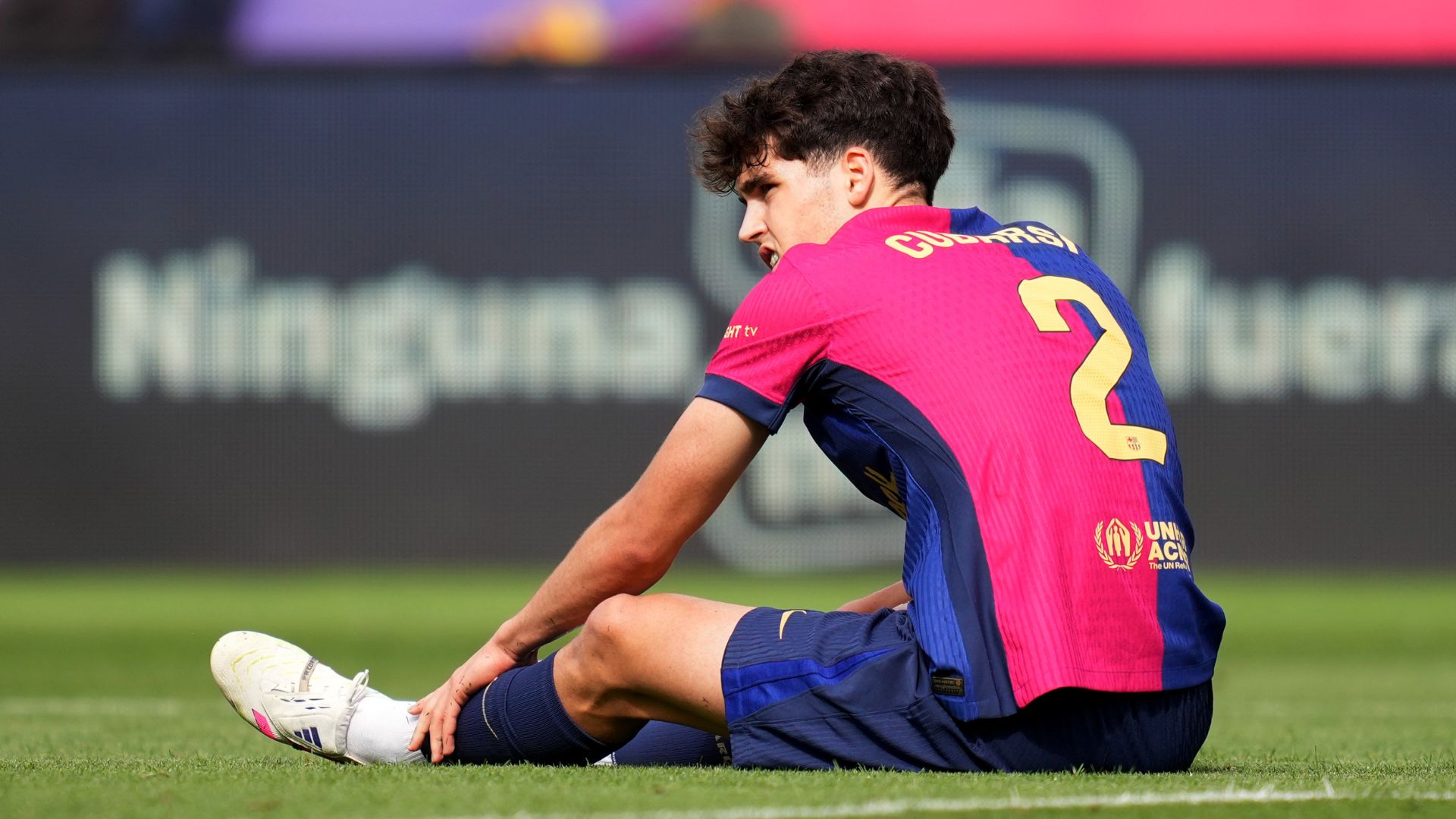 BARCELONA, SPAIN - MAY 11: Pau Cubarsi of FC Barcelona reacts on the floor during the LaLiga match between FC Barcelona and Real Madrid CF at Estadi Olimpic Lluis Companys on May 11, 2025 in Barcelona, Spain.