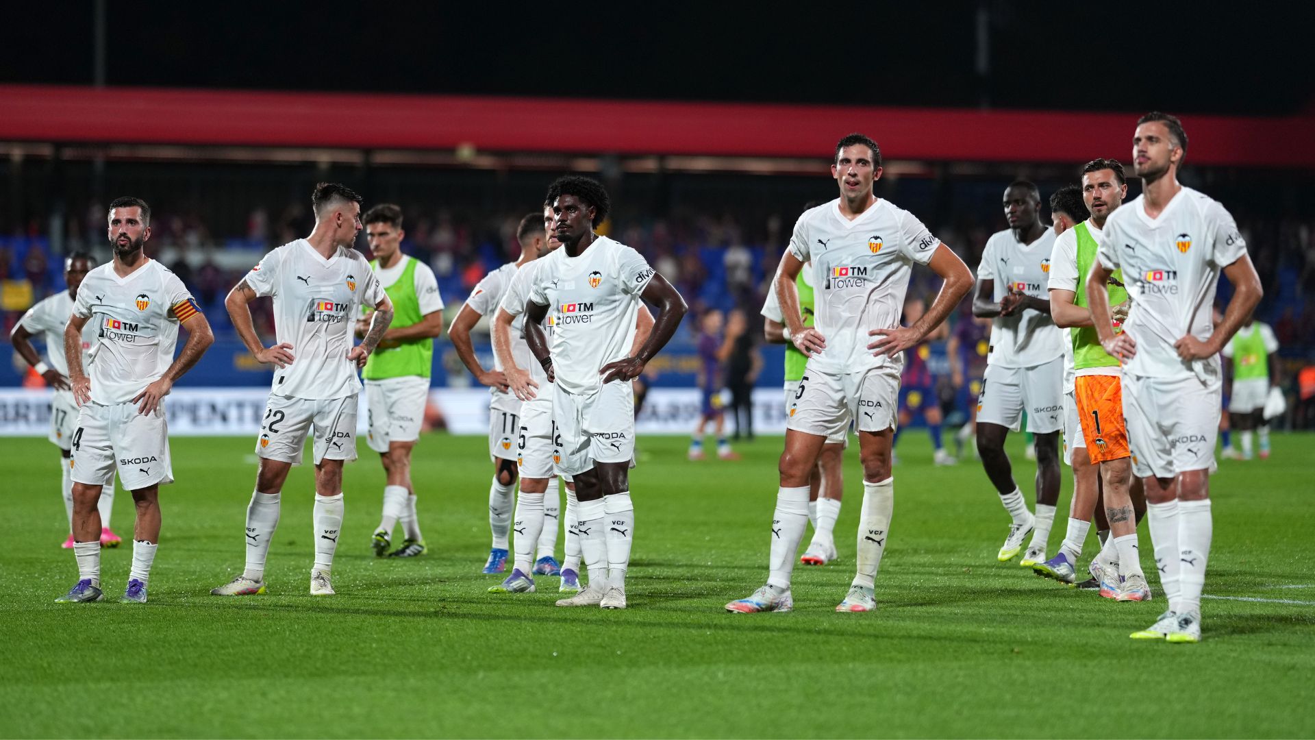 BARCELONA, SPAIN - SEPTEMBER 14: Cesar Tarrega of Valencia CF and teammates react after the team's defeat in the LaLiga EA Sports match between FC Barcelona and Valencia CF at Estadi Johan Cruyff on September 14, 2025 in Barcelona, Spain.