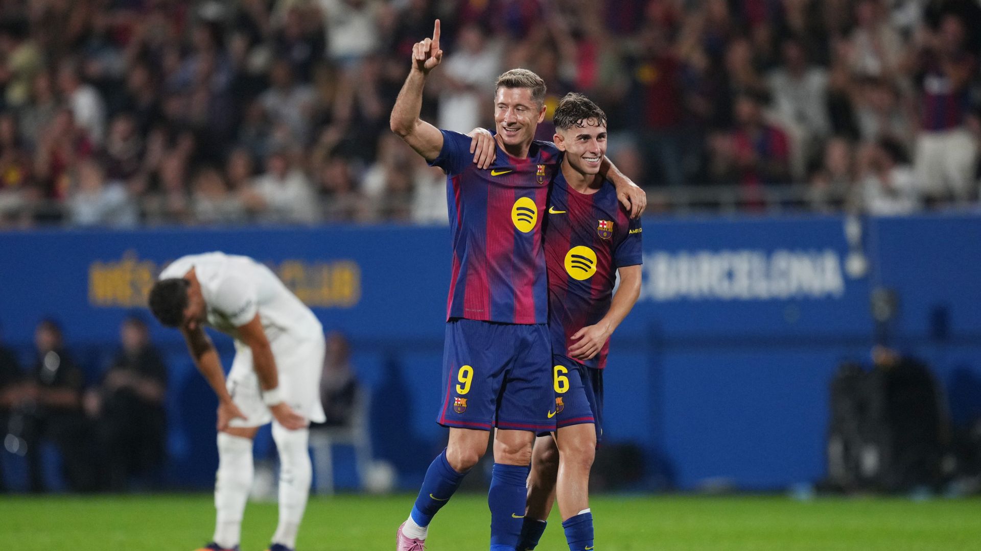 BARCELONA, SPAIN - SEPTEMBER 14: Robert Lewandowski of FC Barcelona celebrates scoring his team's sixth goal with teammate Fermin Lopez during the LaLiga EA Sports match between FC Barcelona and Valencia CF at Estadi Johan Cruyff on September 14, 2025 in Barcelona, Spain.