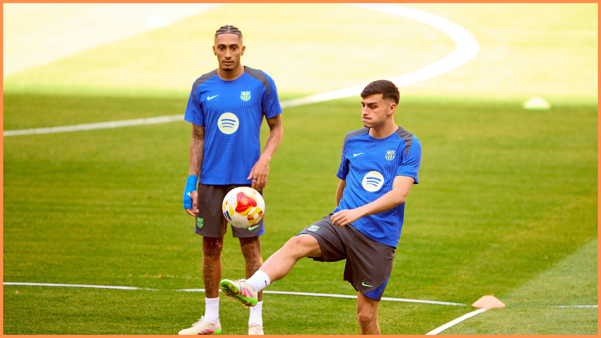 Pedri and Raphinha of FC Barcelona warms up during a training session before the Copa del Rey Final Match between FC Barcelona and Real Madrid at Estadio de La Cartuja.