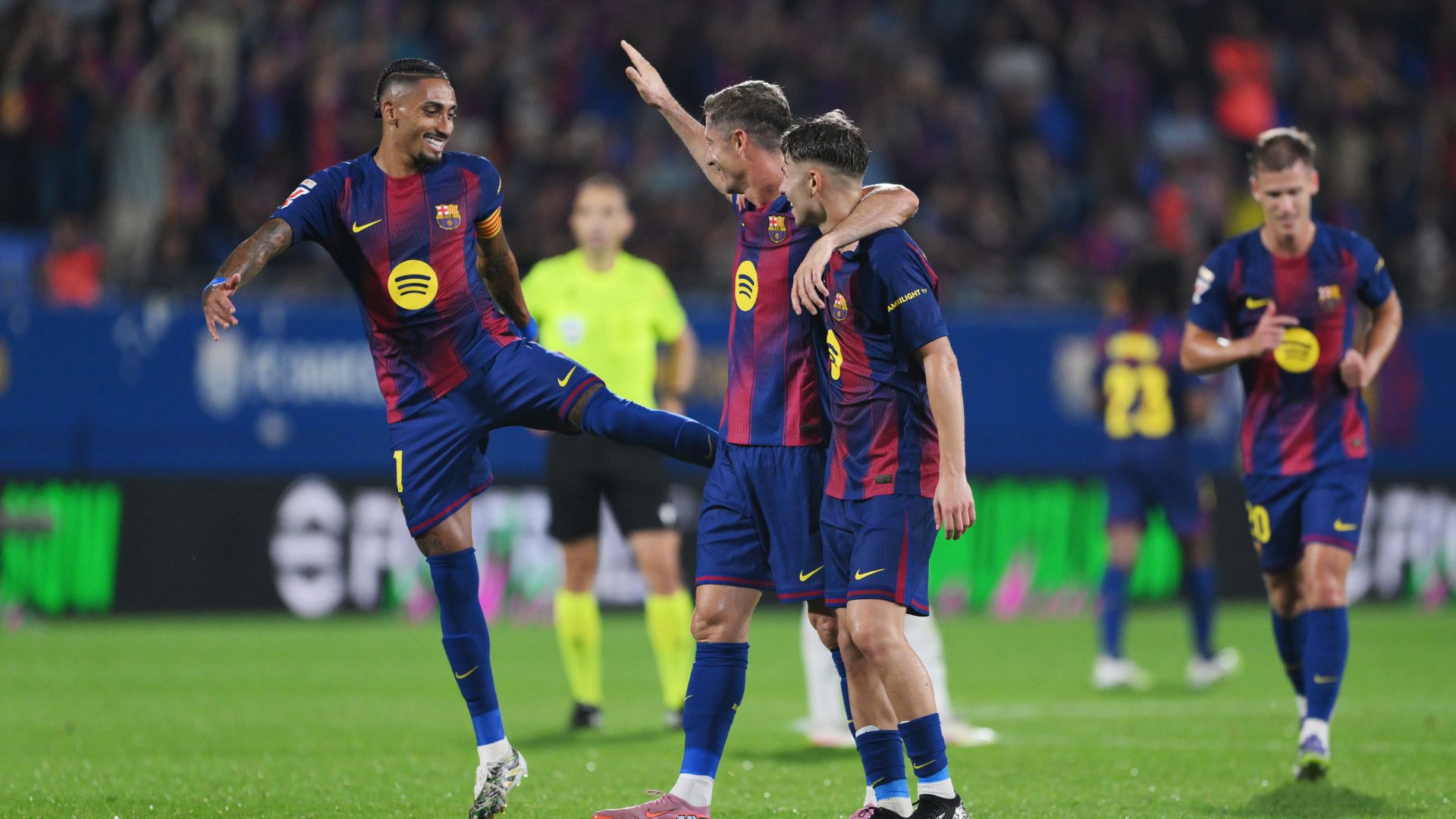BARCELONA, SPAIN - SEPTEMBER 14: Robert Lewandowski of FC Barcelona celebrates scoring his team's sixth goal with teammates Raphinha and Fermin Lopez during the LaLiga EA Sports match between FC Barcelona and Valencia CF at Estadi Johan Cruyff on September 14, 2025 in Barcelona, Spain.