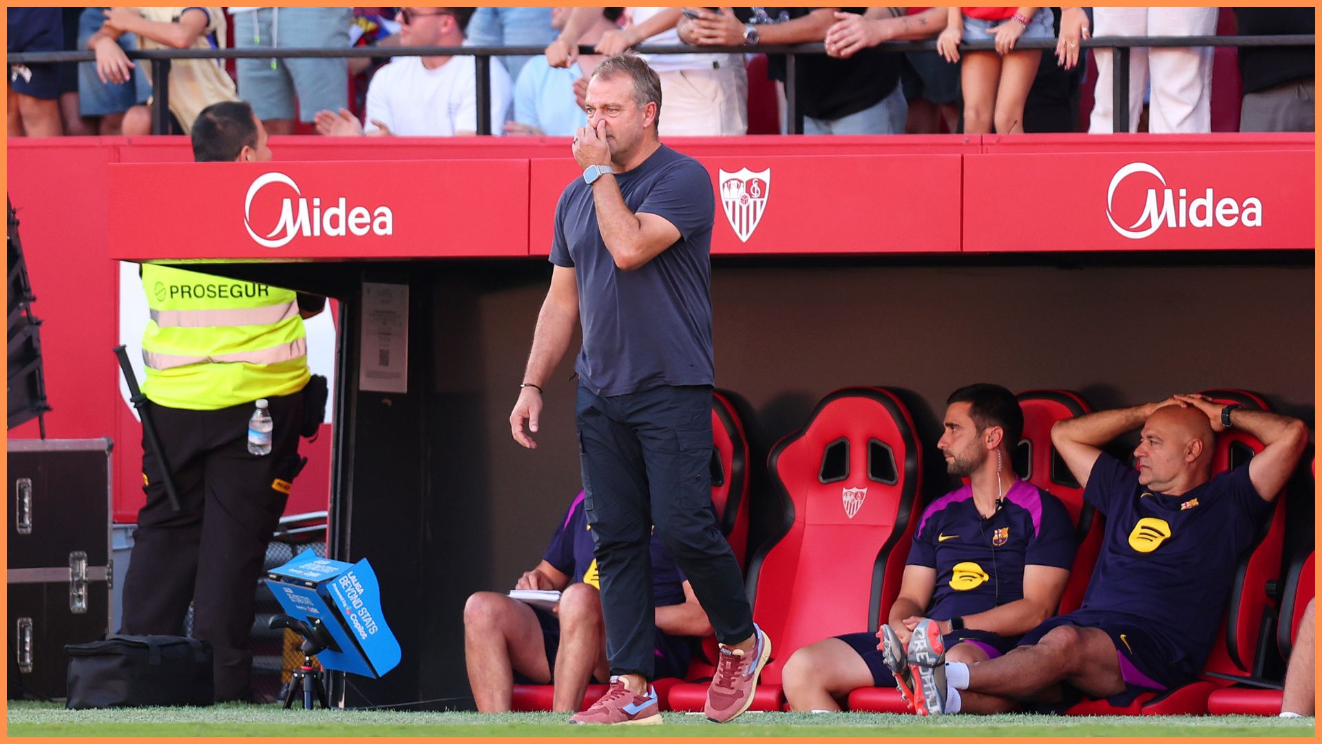 SEVILLE, SPAIN - OCTOBER 05: Hansi Flick, Head Coach of FC Barcelona, reacts during the LaLiga EA Sports match between Sevilla FC and FC Barcelona at Estadio Ramon Sanchez Pizjuan on October 05, 2025 in Seville, Spain.