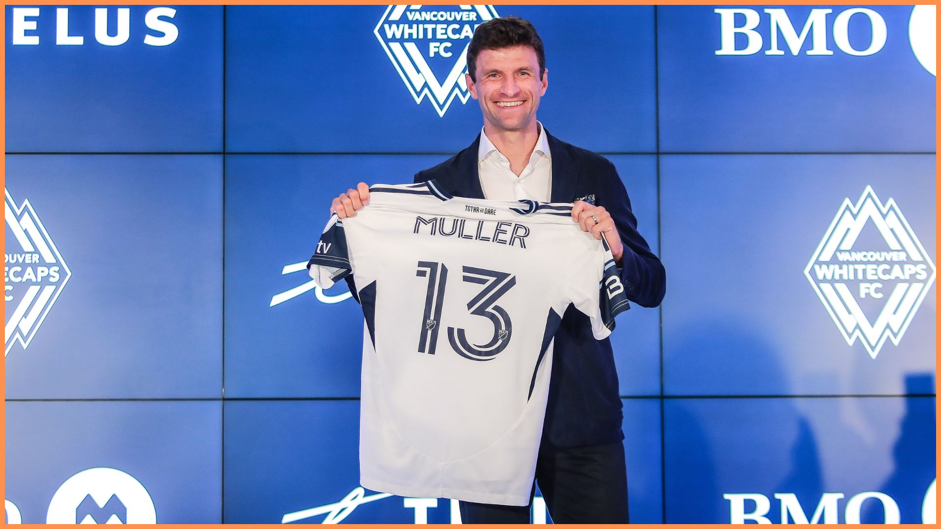 VANCOUVER, BRITISH COLUMBIA - AUGUST 14: German football player Thomas Müller holds his jersey as he was introduced by the Vancouver Whitecaps during a press conference at TELUS Garden on August 14, 2025 in Vancouver, British Columbia.
