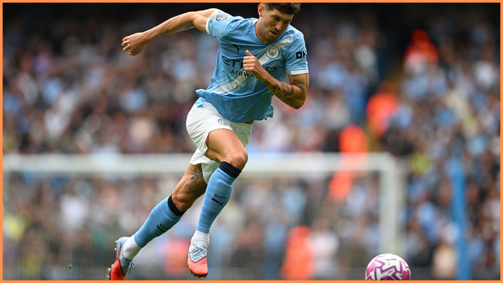 MANCHESTER, ENGLAND - AUGUST 23: John Stones of Manchester City runs with the ball during the Premier League match between Manchester City and Tottenham Hotspur at Etihad Stadium on August 23, 2025 in Manchester, England.