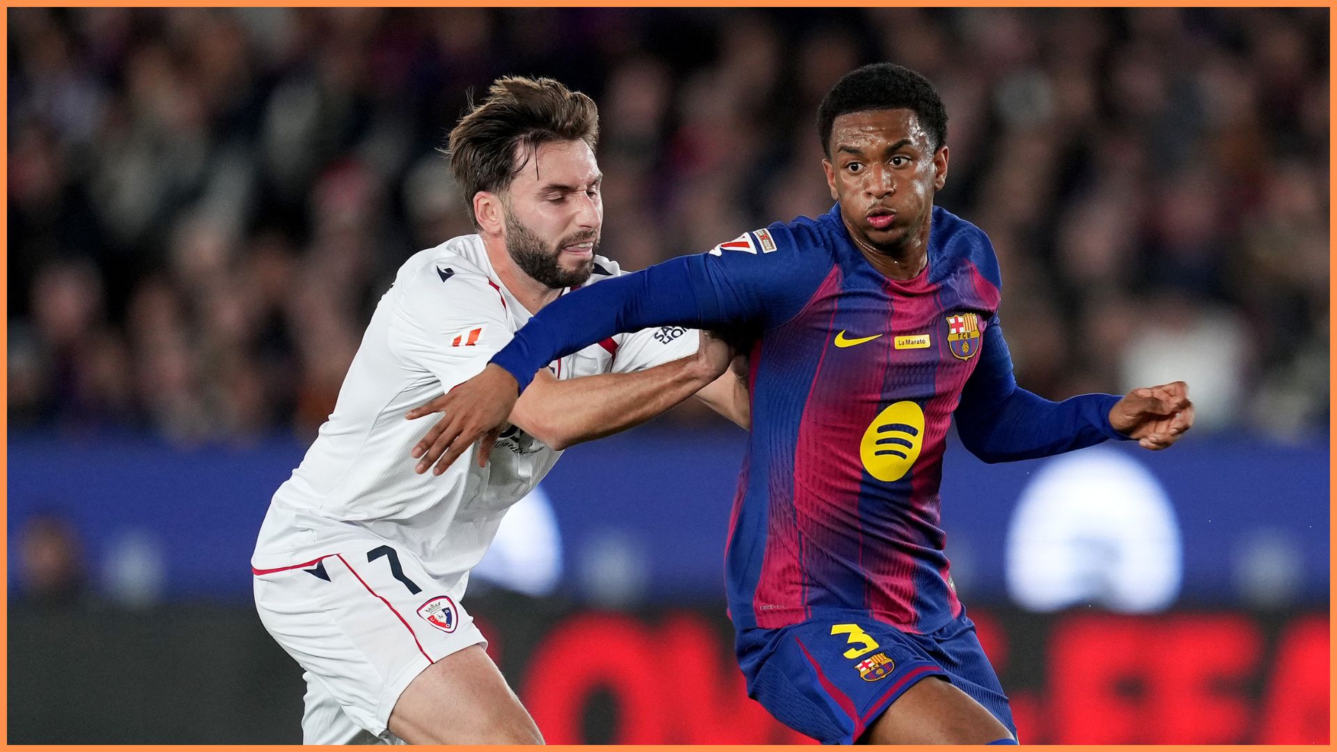 BARCELONA, SPAIN - DECEMBER 13: Alejandro Balde of FC Barcelona is challenged by Jon Moncayola of CA Osasuna during the LaLiga EA Sports match between FC Barcelona and CA Osasuna at Spotify Camp Nou on December 13, 2025 in Barcelona, Spain.
