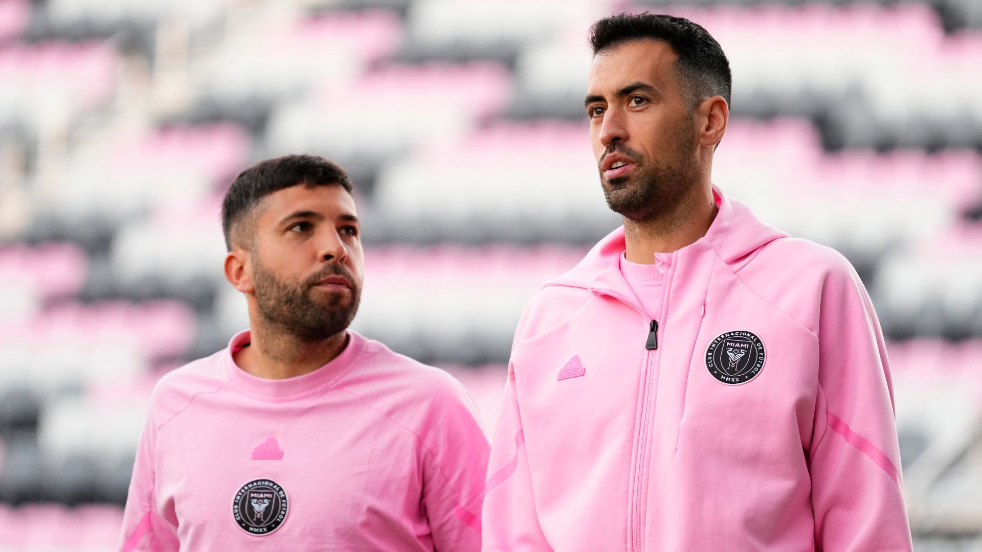 FORT LAUDERDALE, FLORIDA - FEBRUARY 15: Jordi Alba #18 and Sergio Busquets #5 of Inter Miami CF arrive before a friendly match between Newell's Old Boys and Inter Miami CF at DRV PNK Stadium on February 15, 2024 in Fort Lauderdale, Florida.