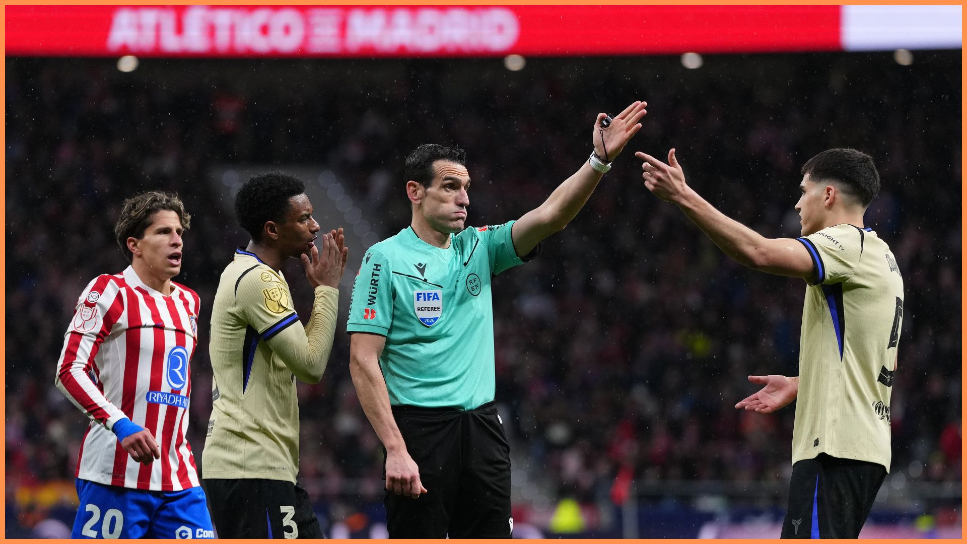 MADRID, SPAIN - FEBRUARY 12: Referee Juan Martinez Munuera gestures for a direct free kick after a handball from Eric Garcia of FC Barcelona (not pictured) during the Copa Del Rey Semi-Final First Leg match between Atletico de Madrid and FC Barcelona at Riyadh Air Metropolitano on February 12, 2026 in Madrid, Spain.