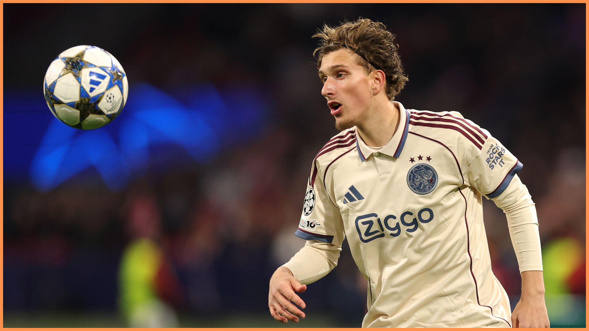 AMSTERDAM, NETHERLANDS - NOVEMBER 25: Mika Godts of Ajax in action during the UEFA Champions League 2025/26 League Phase MD5 match between AFC Ajax and SL Benfica at Johan Cruijff Arena on November 25, 2025 in Amsterdam, Netherlands.
