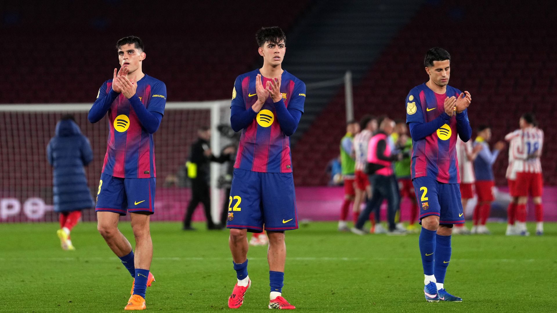 BARCELONA, SPAIN - MARCH 03: Gerard Martin, Marc Bernal and Joao Cancelo of FC Barcelona, applaud the fans after the Copa Del Rey Semi Final Second Leg match between FC Barcelona and Atlético de Madrid at Camp Nou on March 03, 2026 in Barcelona, Spain.