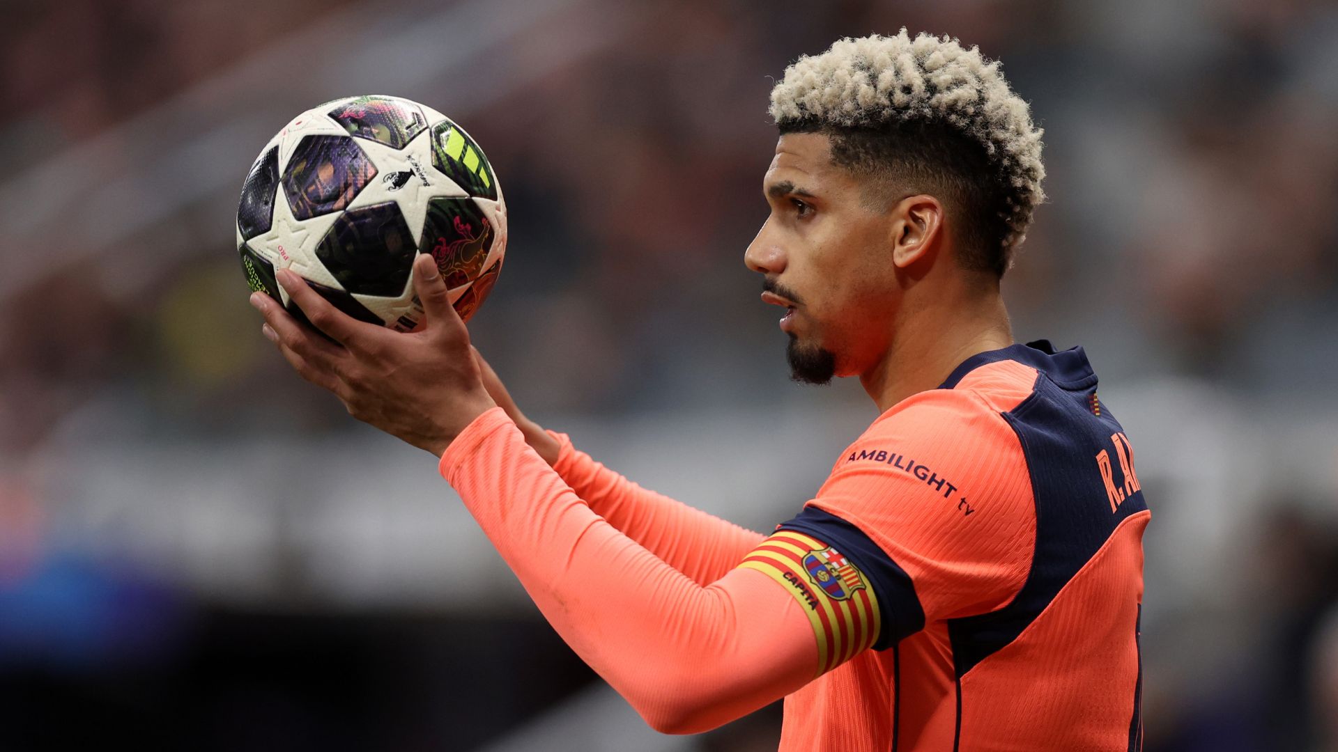 NEWCASTLE UPON TYNE, ENGLAND - MARCH 10: Ronald Araujo of FC Barcelona takes a throw in during the UEFA Champions League 2025/26 Round of 16 First Leg match between Newcastle United FC and FC Barcelona at St James' Park on March 10, 2026 in Newcastle upon Tyne, England.