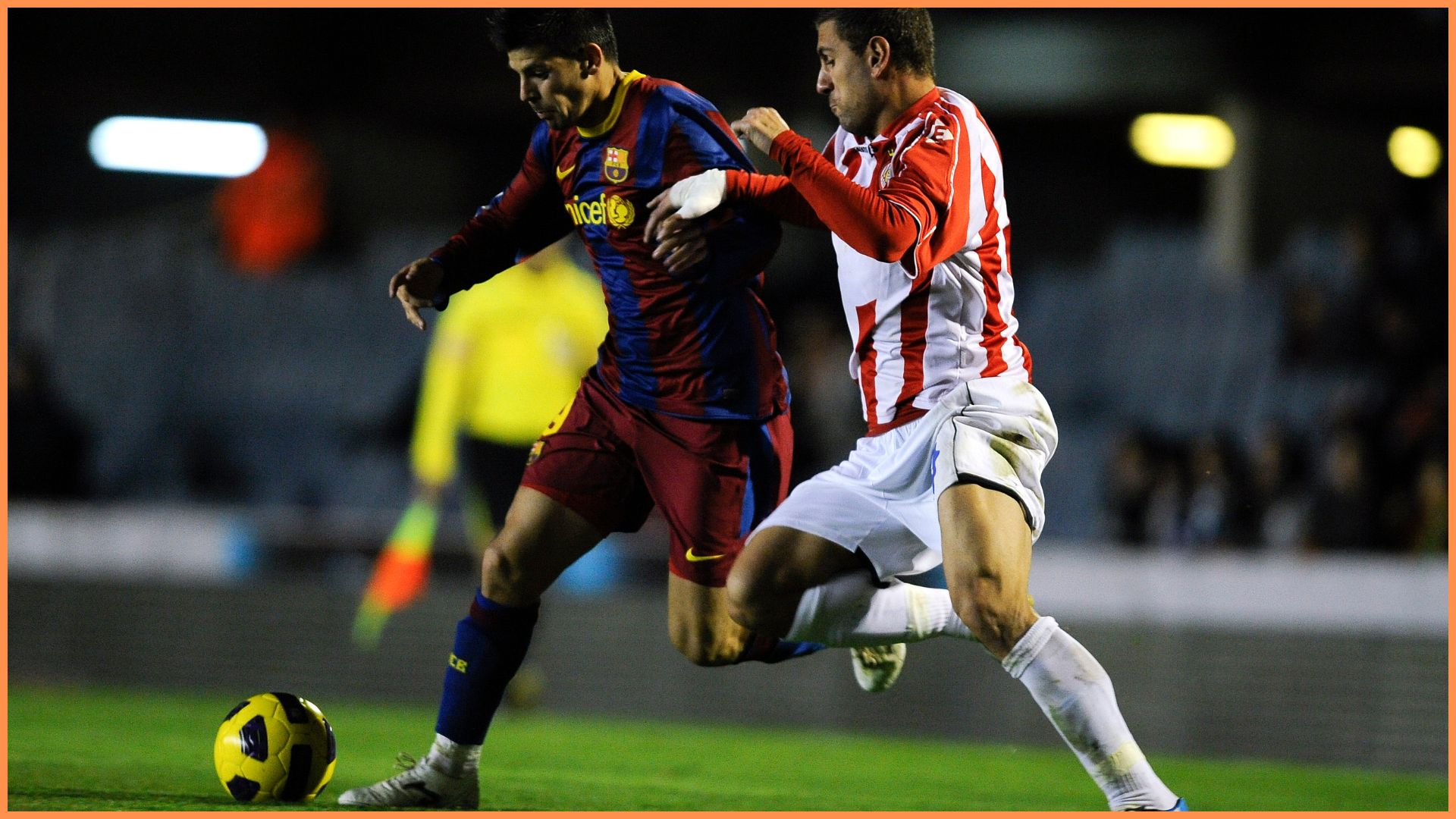 BARCELONA, SPAIN - JANUARY 08: Nolito of FC Barcelona B (L) duels for the ball against Migue of Girona during the La Liga Adelante match between FC Barcelona B and Girona at Mini Estadi on January 8, 2011 in Barcelona, Spain.